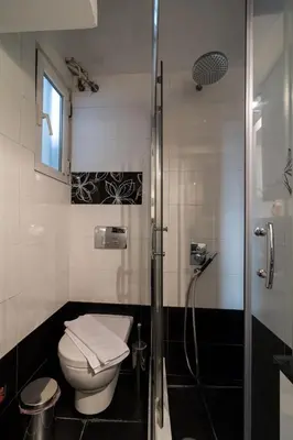 a bathroom with a toilet and a shower at An adorable Apartment in Athens in Athens