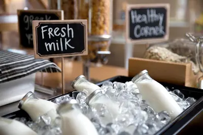 a display of fresh milk signs in a store at Blazer Suites Hotel in Athens