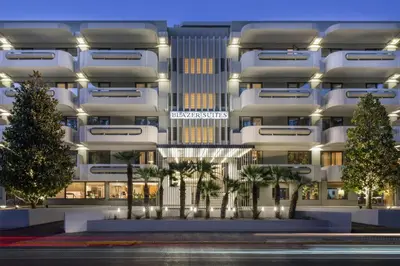 a rendering of a building with palm trees in front at Blazer Suites Hotel in Athens