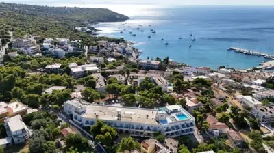 an aerial view of a city with boats in the water at Galini Hotel in Agia Marina Aegina