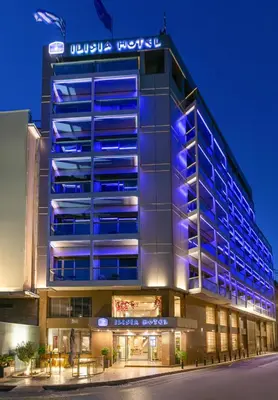 a building with blue lights on the side of it at Ilisia Hotel Athens in Athens