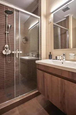 a bathroom with a glass shower and a sink at Athens Way Pop Art Hotel in Athens