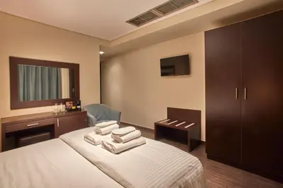 a bedroom with a bed with towels on it at Athens Way Pop Art Hotel in Athens