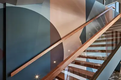a staircase in a house with a glass wall at Candia Hotel in Athens