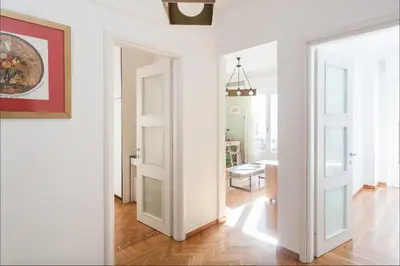 an open door in a white room with a hallway at Beautiful Apartment at Plaka in Athens