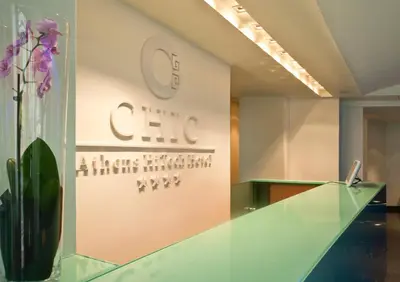 a lobby of an office with a sign on the wall at Chic Hotel in Athens