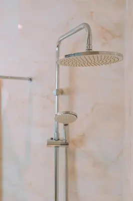 a shower with a shower head in a bathroom at Chic Hotel in Athens