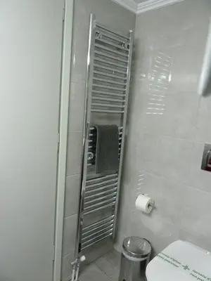 a bathroom with a shower with a toilet and a sink at Architect Designer's Apartment in Kolonaki in Athens