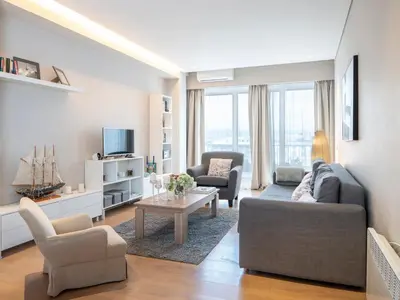 a living room with a couch and a table at Central Athens Loft in Athens