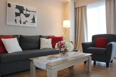 a living room with a couch and a coffee table at Central Athens Loft in Athens