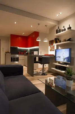 a living room with a couch and a tv in it at Luxury 2 bdrm apartment 10' minutes walk from the Acropolis in Athens