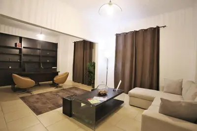 a living room with a couch and a table at GK Athens by GK Properties in Athens