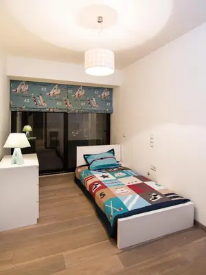 a bedroom with a bed in a room at Hidden Sanctuary In Saronida in Anavissos