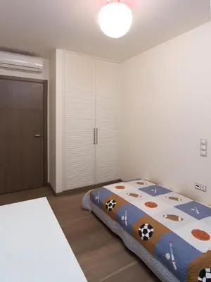 a bedroom with a bed with cows on it at Hidden Sanctuary In Saronida in Anavissos