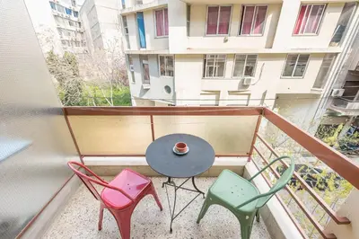 a balcony with a table and chairs on it at Zenios Amintas-Pop-artment for two in city center in Athens