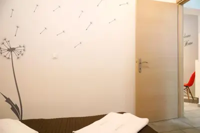 a room with a sliding door with arrows on the wall at Gazi Boutique Apartment 1 in Athens
