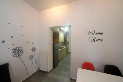 a dining room with a wall with a dandelion decal at Gazi Boutique Apartment 2 in Athens