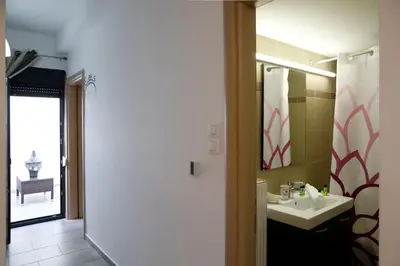 a bathroom with a sink and a mirror at Gazi Boutique Apartment 2 in Athens