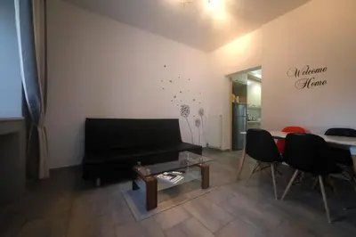 a living room with a black piano and a table at Gazi Boutique Apartment 2 in Athens