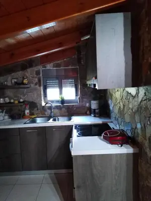a kitchen with a sink and a counter top at Panoramic Voula's View Apartment in Athens