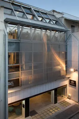an external view of a building with a glass facade at Pi Athens in Athens