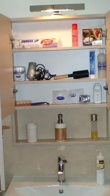 a bathroom counter with a sink and shelves above it at Oro's Stylish Kolonaki Flats Next to Metro & Museums in Athens