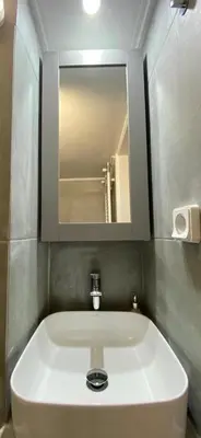 a bathroom with a sink and a mirror at Plato's Academy Home in Athens