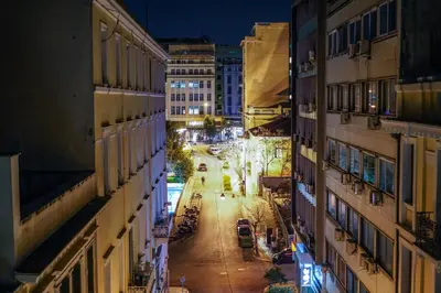 a view of a city street at night at ApArt Suite in Athens