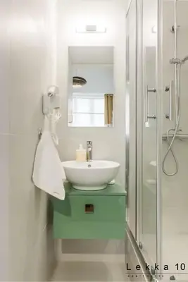 a bathroom with a sink and a shower at Lekka 10 Apartments in Athens