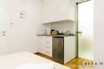 a small kitchen with a sink and a stove at Lekka 10 Apartments in Athens