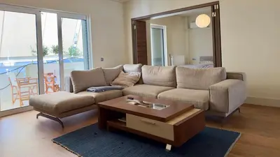 a living room with a couch and a coffee table at Captains 2-Bedroom Suite in Athens Nea Smyrni in Athens