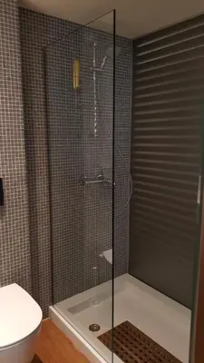 a shower with a glass door in a bathroom at Captains 2-Bedroom Suite in Athens Nea Smyrni in Athens