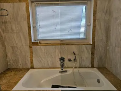 a white sink with a window in a bathroom at 3 bedder condo in Ilisia, Megaro Mousikis in Athens