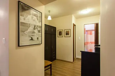 a hallway with a picture of a baseball game on the wall at Psyri Neoclassical House Yard Free Parking in Athens