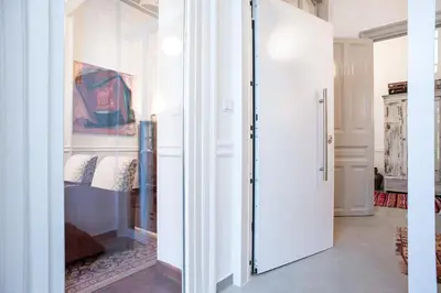 a room with a closet with a sliding glass door at Neoclassical House at Metro Station Attiki in Athens
