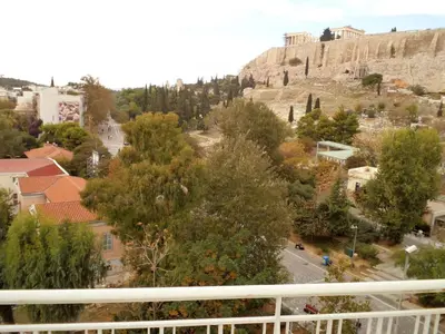 a view from a balcony of a city with a mountain at Star Acropolis Apartment in Athens