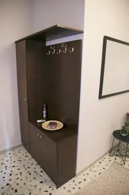 a shelf in a room with a plate on it at Mairas house collection in Athens