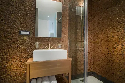 a bathroom with a sink and a mirror at NLH FIX | Neighborhood Lifestyle Hotels in Athens