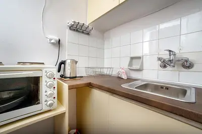 a kitchen with a sink and a microwave at Acropolis Area Flat with Parthenon Views in Athens