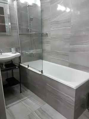 a bathroom with a shower and a tub and a sink at Errathens Apartments - Athens Center in Athens
