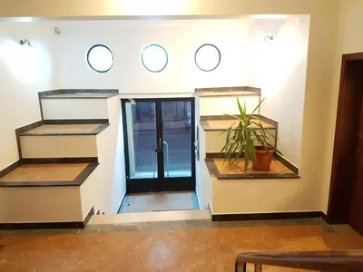 a room with a door and a plant in it at Errathens Apartments - Athens Center in Athens