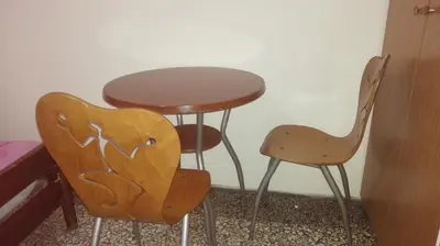 two chairs and a table and a table and chairs at Hotel Korydallos in Piraeus