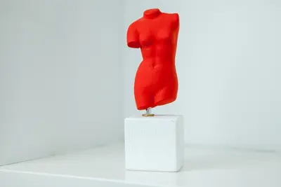 a red dress sitting on top of a white box at Athens Avaton Suites in Athens