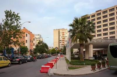a street with cars parked on the side of the road at KYMA Apartments - Athens Acropolis 8 in Athens
