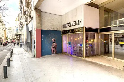 a building with a door with a statue on it at Emerald Suite in Athens