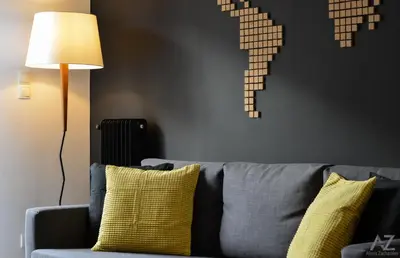 a living room with a couch and a lamp at Phaedra Apartment in Athens