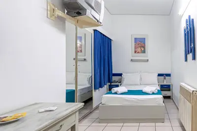a hospital room with two beds and a desk at ROY Hotel in Athens