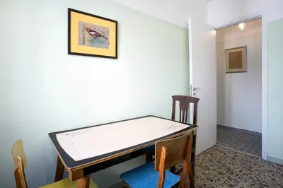 a ping pong table in a room with chairs at Lovely two-bedroom apartment with roof garden! EP7 in Athens