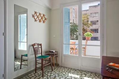 a room with a door and two chairs and a table at Lovely two-bedroom apartment with roof garden! EP7 in Athens