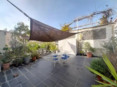 a patio with a hammock hanging from a building at Lovely two-bedroom apartment with roof garden! EP7 in Athens